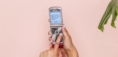 turned-on silver flip phone