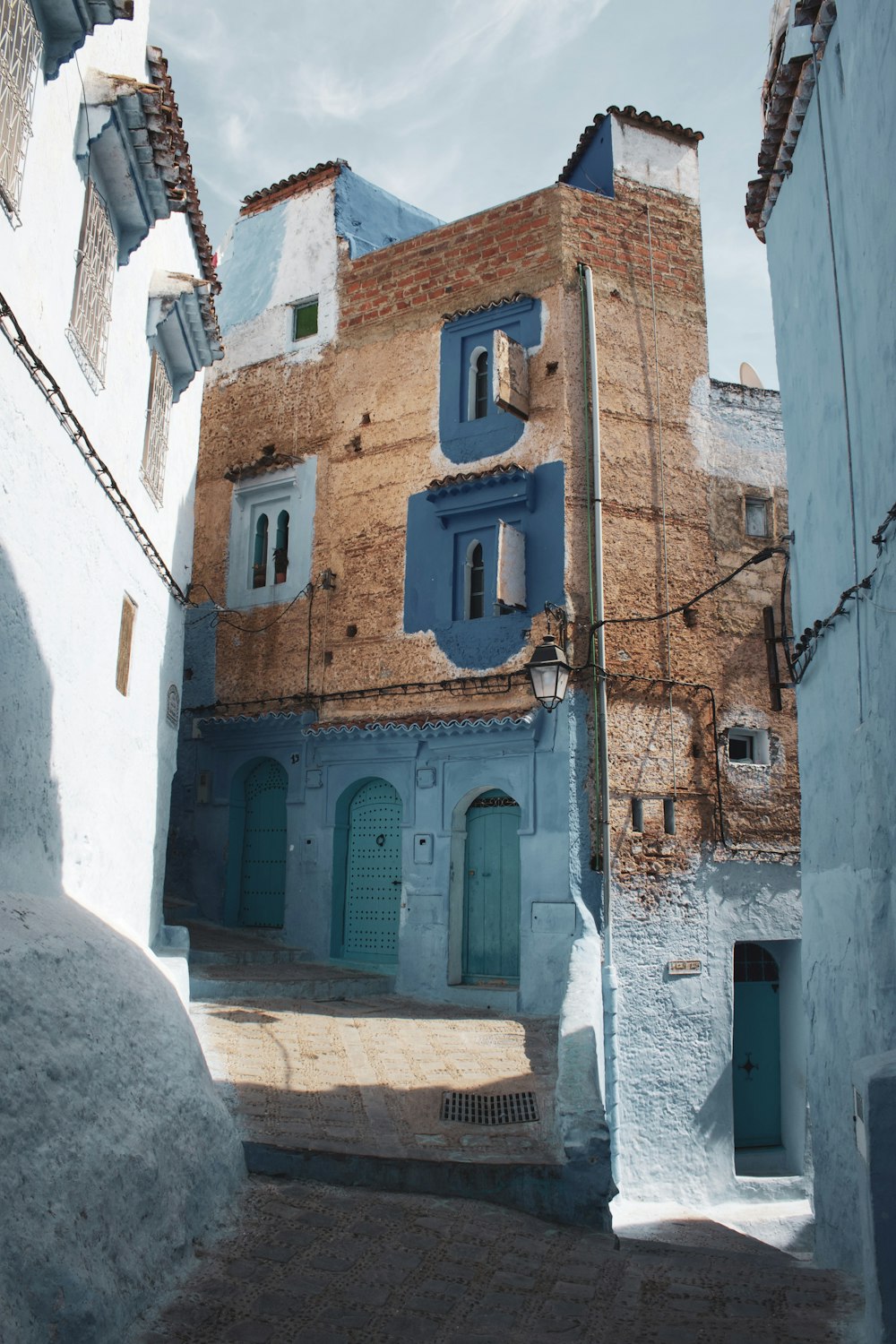 brown and blue concrete buildings during daytime