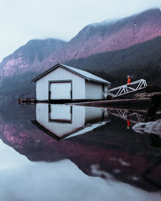 white wooden cottage in Buntzen Lake Canada