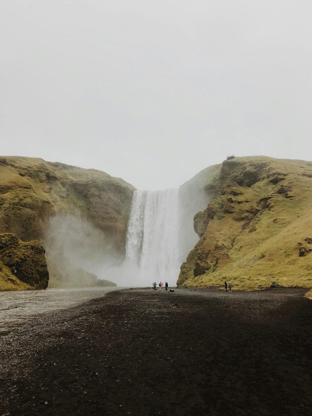 people near waterfalls