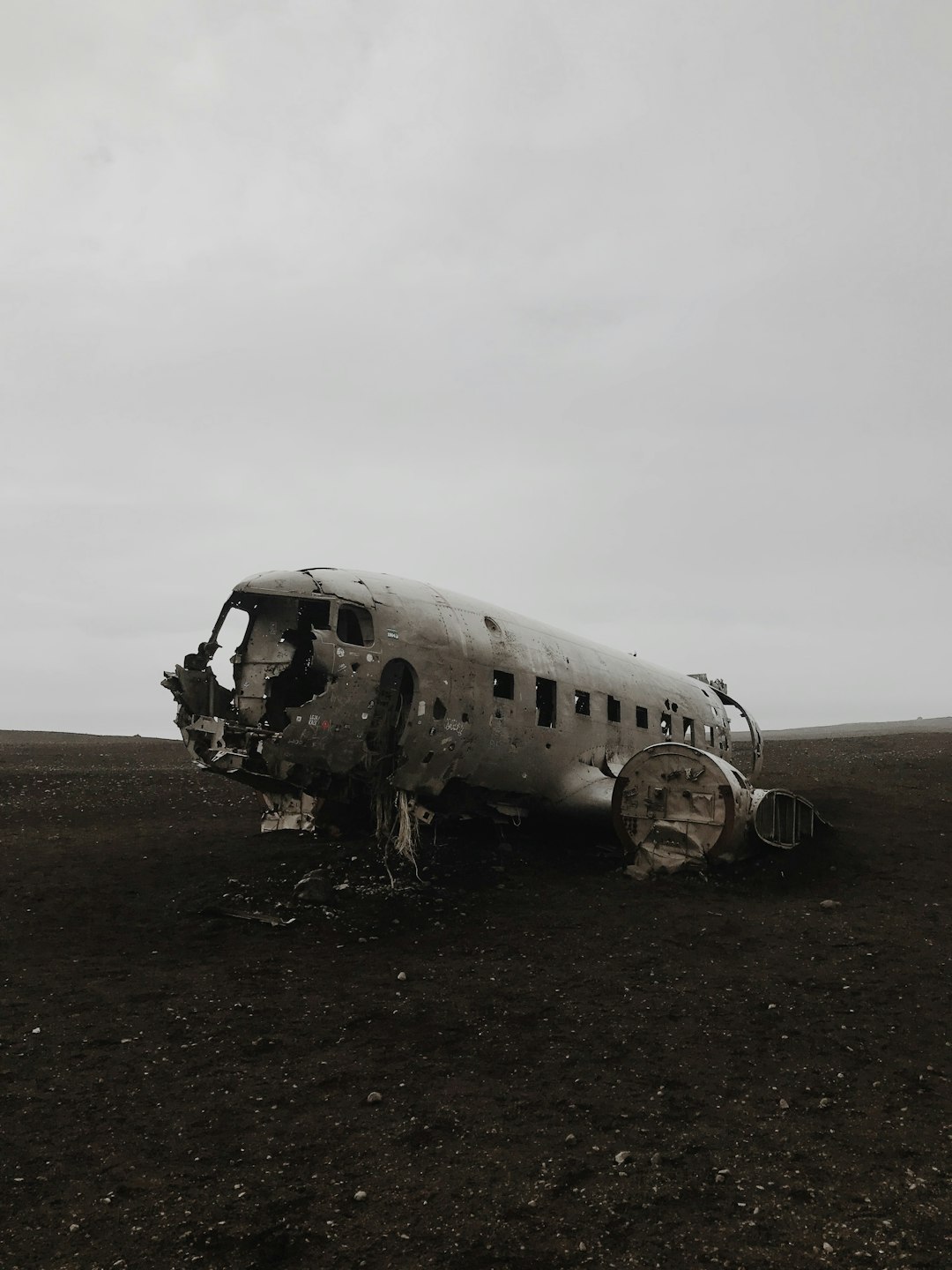 wrecked airplane under gray sky