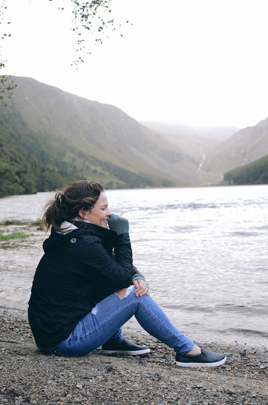 woman on seashore in Wicklow Mountains National Park Ireland