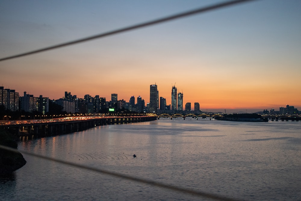 city and sea during golden hour