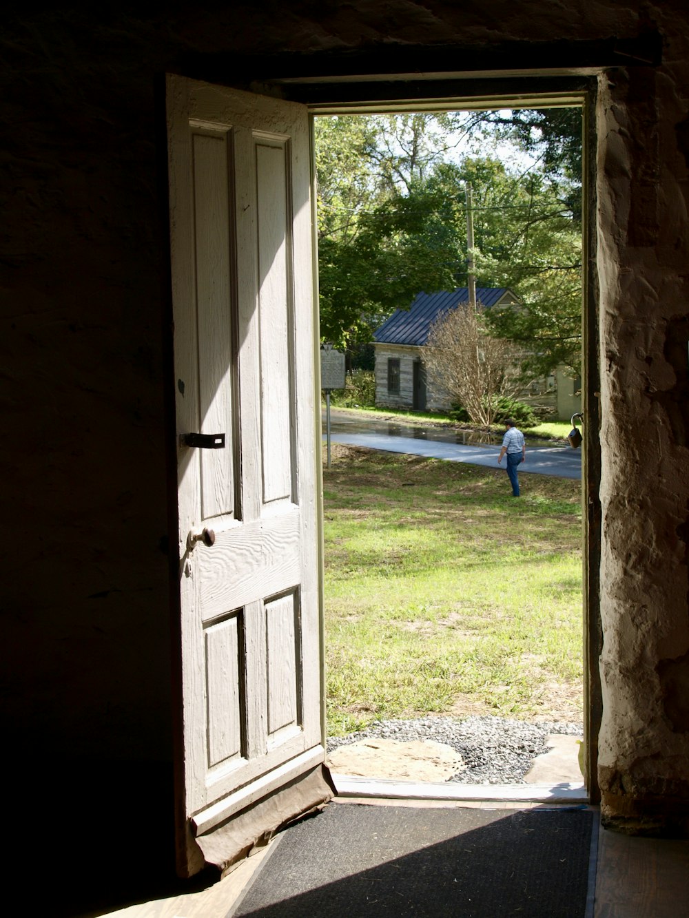 opened white 4-panel door