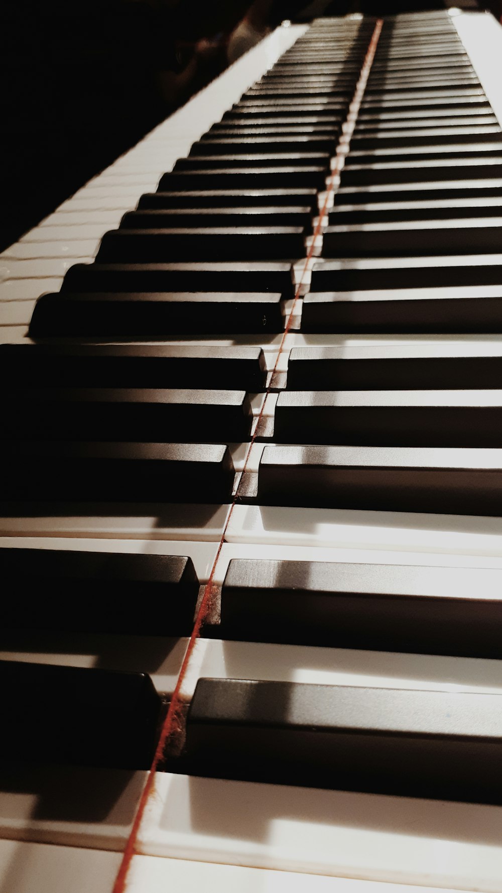 shallow focus photo of piano