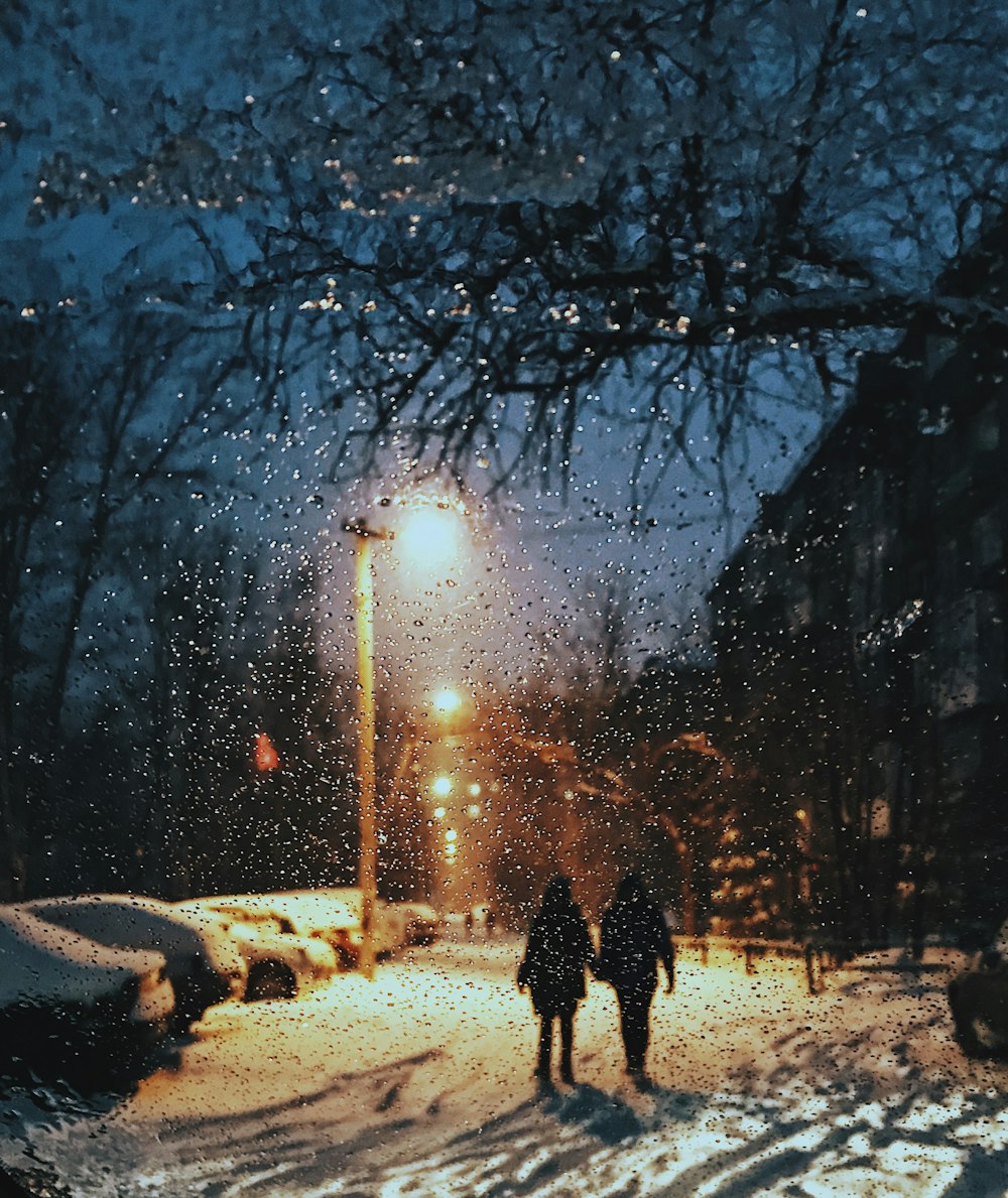 two women standing on snow