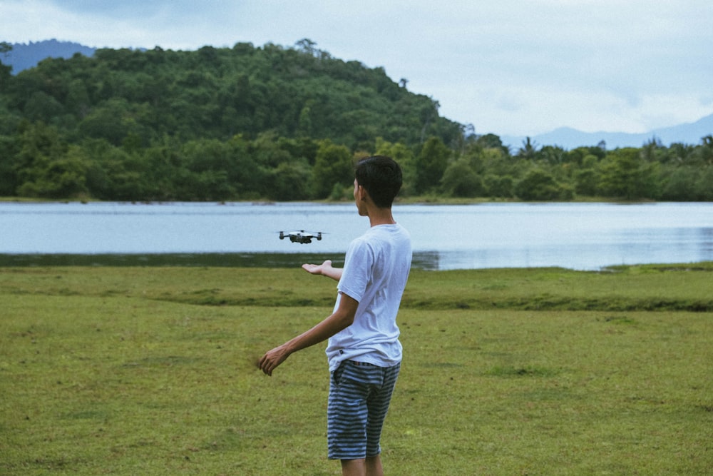 man about to catch drone