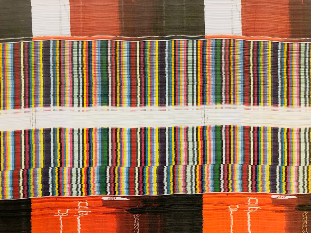 blue, red, and black striped wallpaper