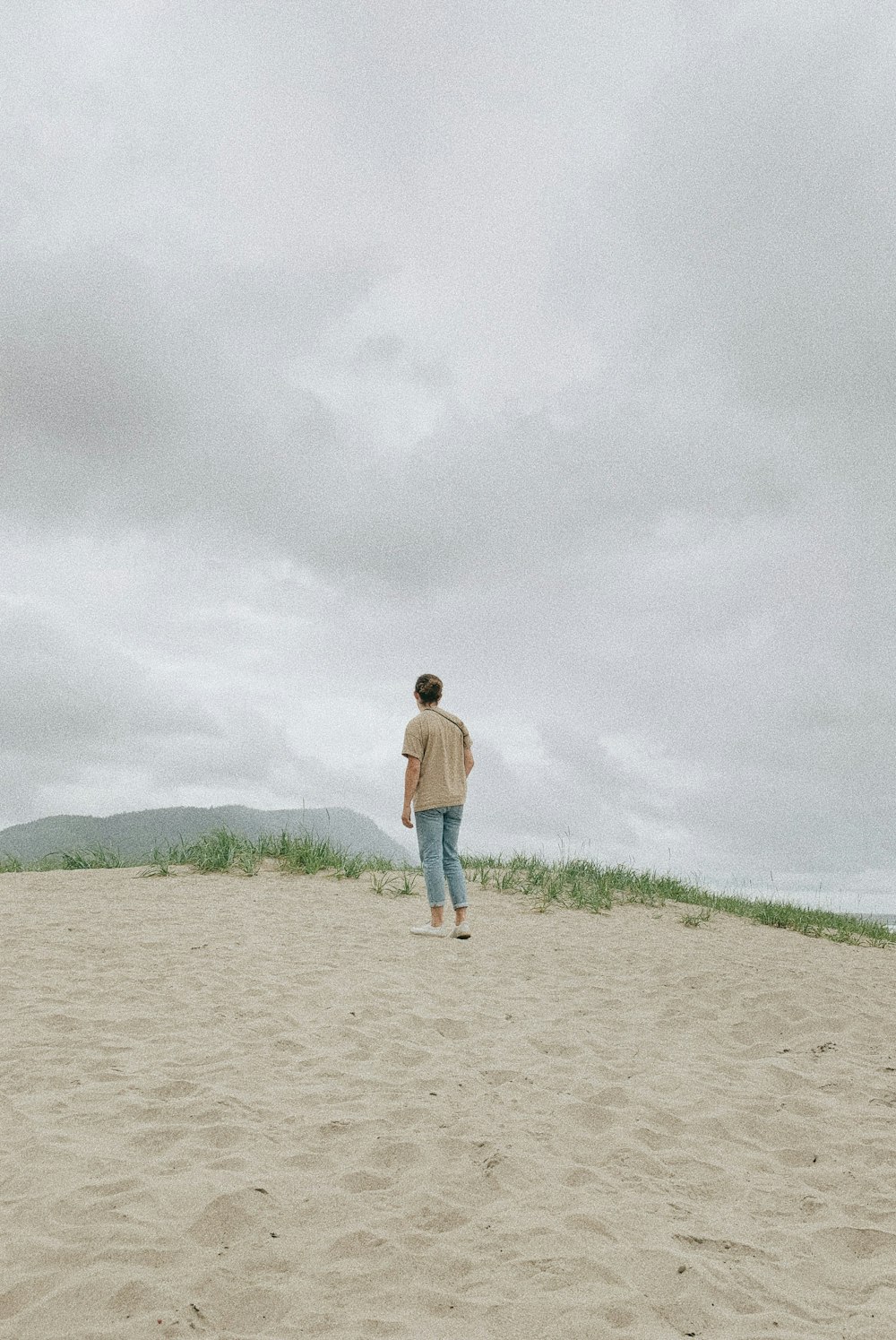 man standing on seashore