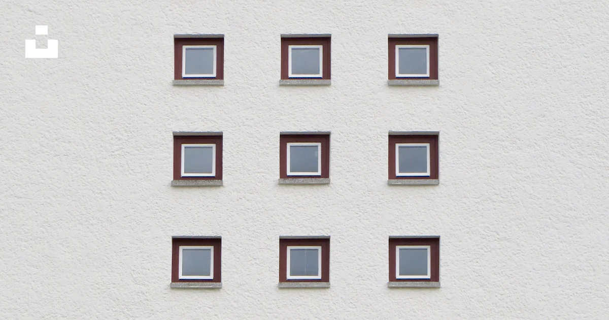 Multiple Window Square A white wall with many square windows on it photo – Free Wall Image on ...
