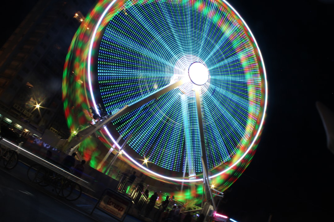 low-angle photography of blue ferris wheel