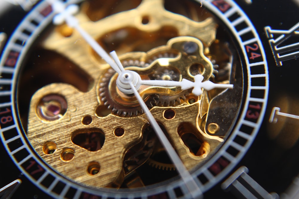 gold-colored mechanical watch