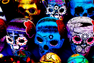 Close-up of handcrafted colorful calavera skulls with intricate patterns