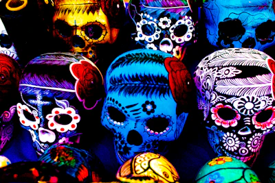 Close-up of handcrafted colorful calavera skulls with intricate patterns