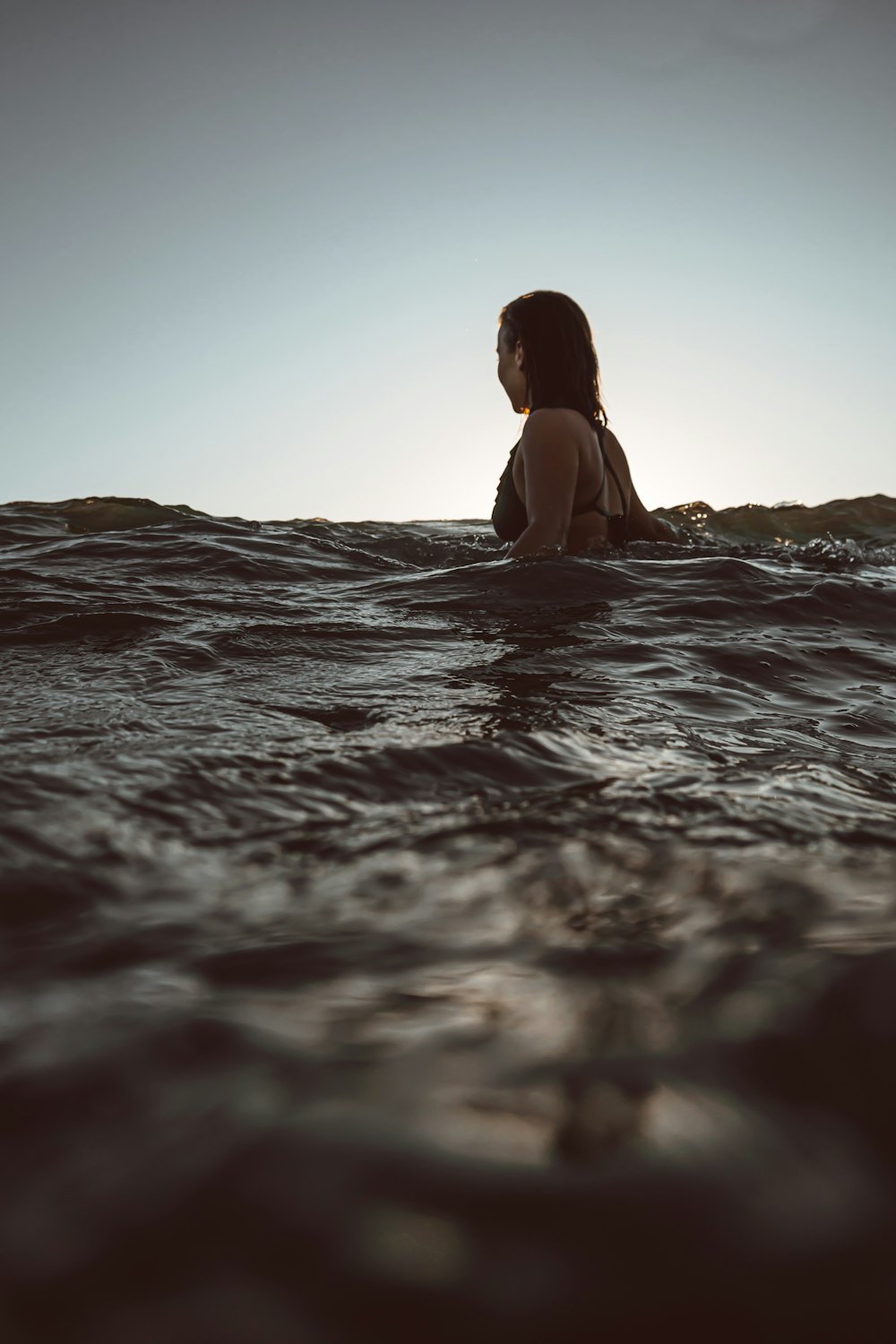 woman in body of water during daytime