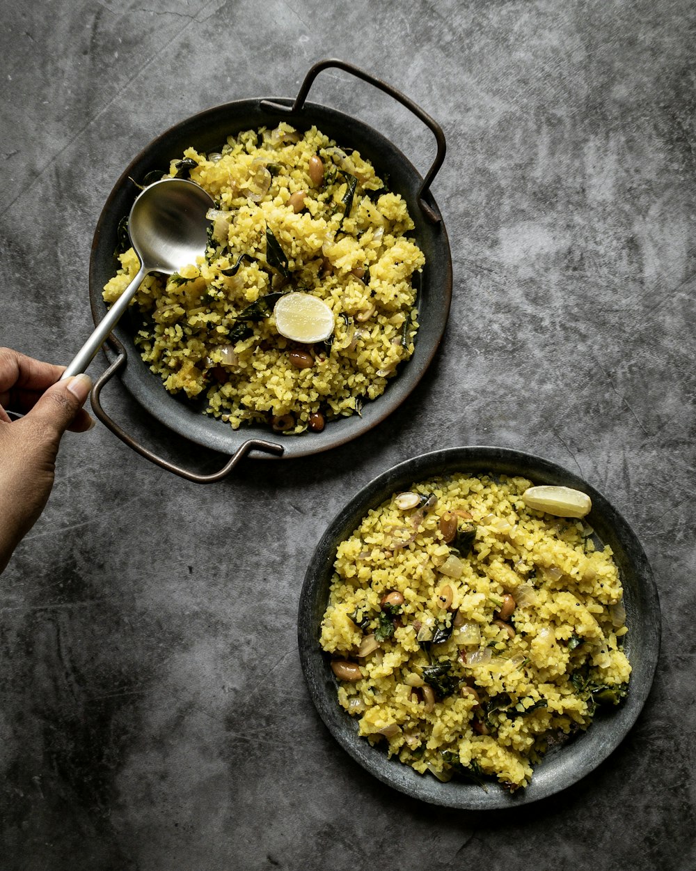 yellow rice in black wok