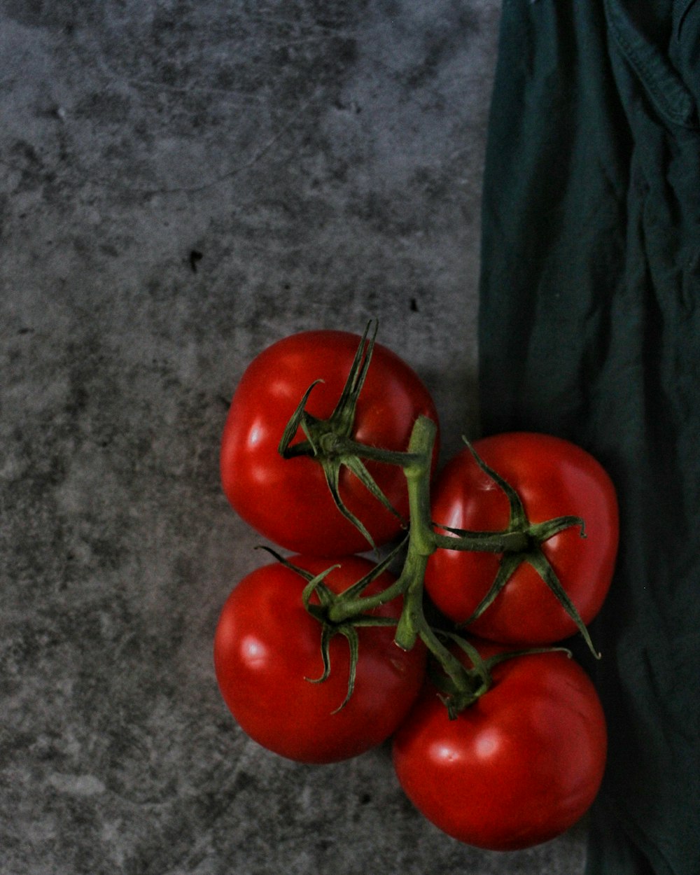 four red tomatoes