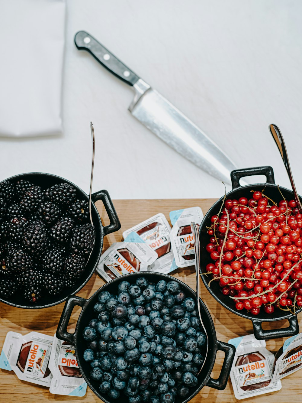 berries and currants filled crock pots