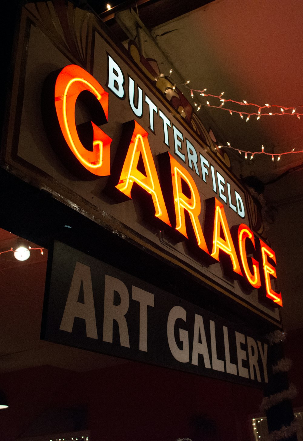 turned-on Butterfield Garage neon sign