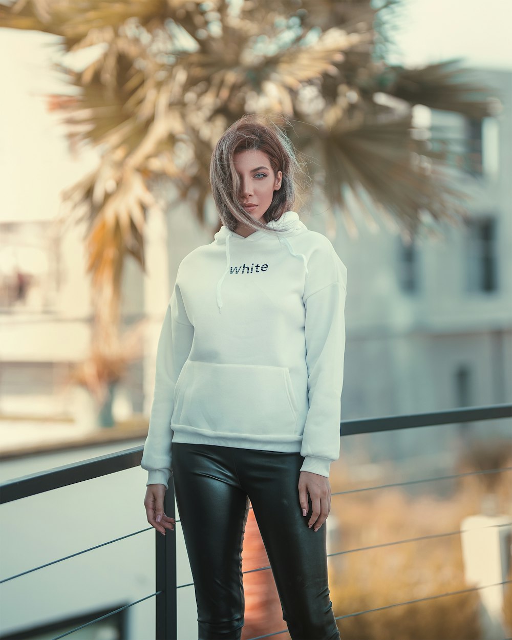 woman wearing white pullover hoodie