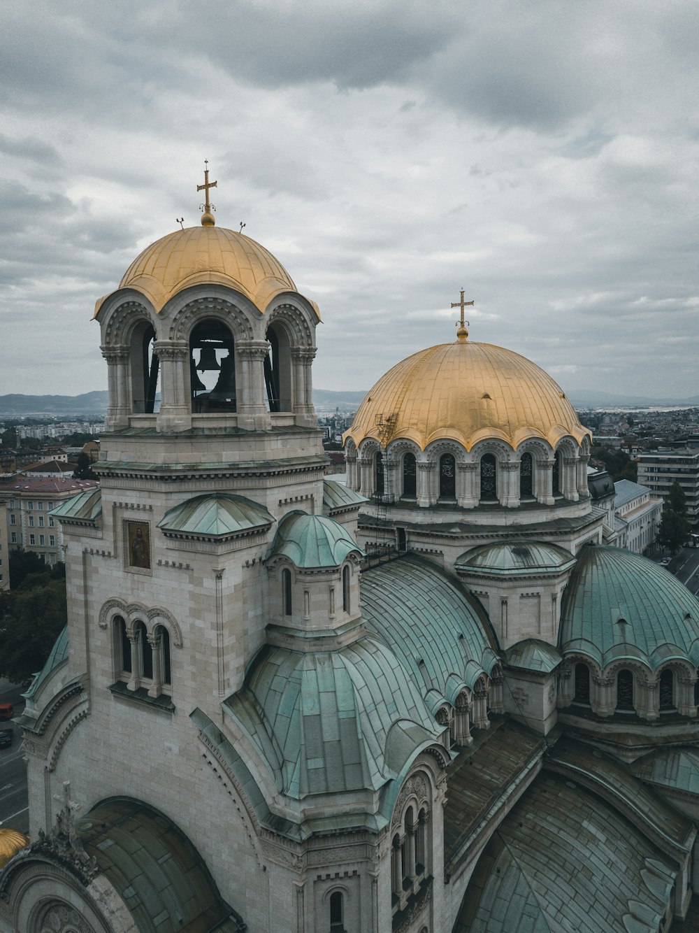 gray stone church with domed roofs