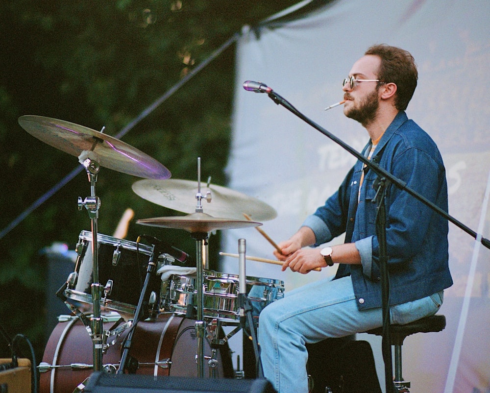 man plays drum