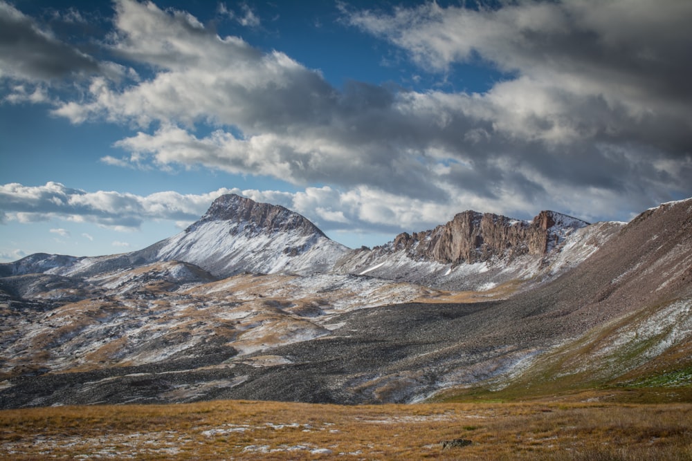 landscape photography of a mountain under a cloudy sky