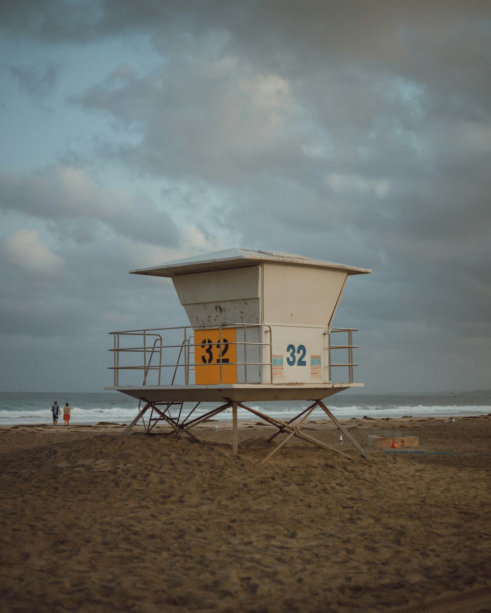 white and brown guardhouse under cloudy sky