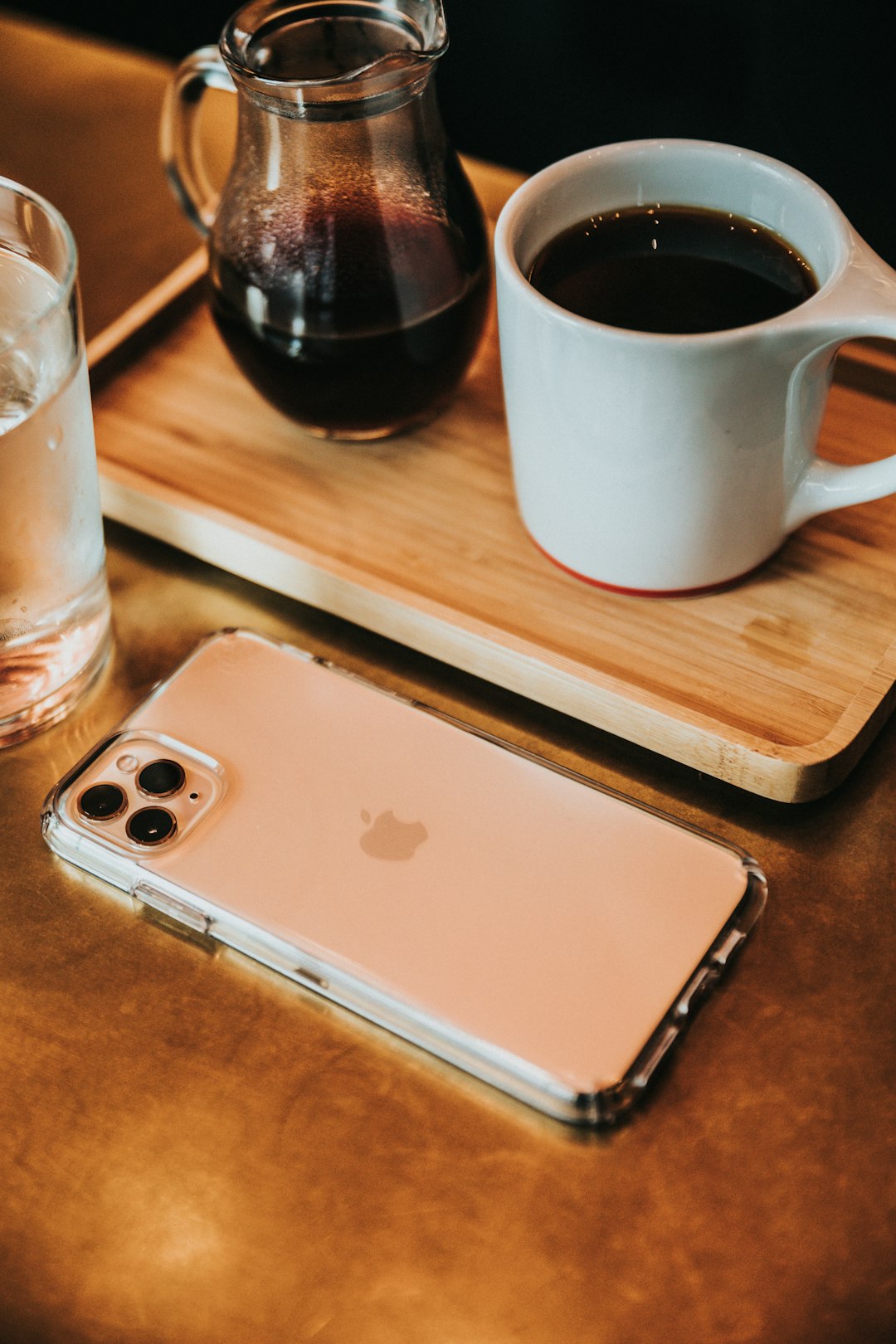 white iPhone smartphone beside coffee on tray
