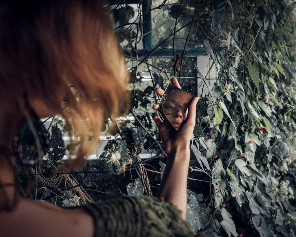 woman holding mirror