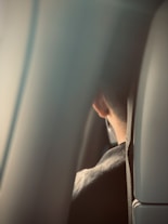 a man sitting in a seat on an airplane