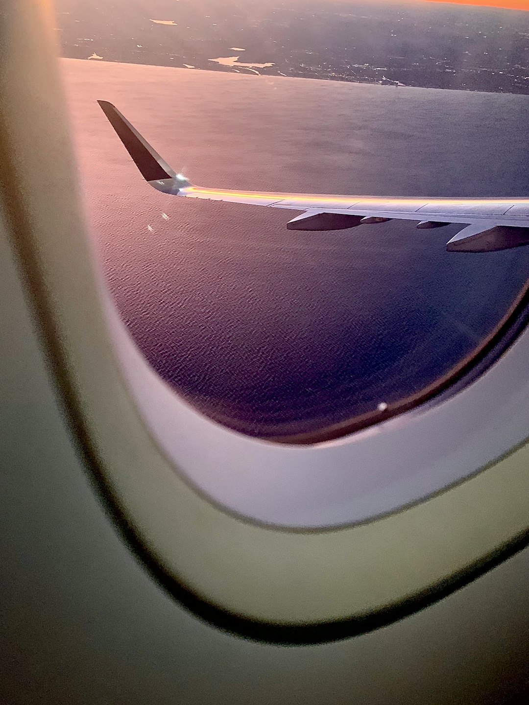 white and red airplane window