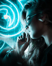 woman wearing sunglasses near blue neon lights