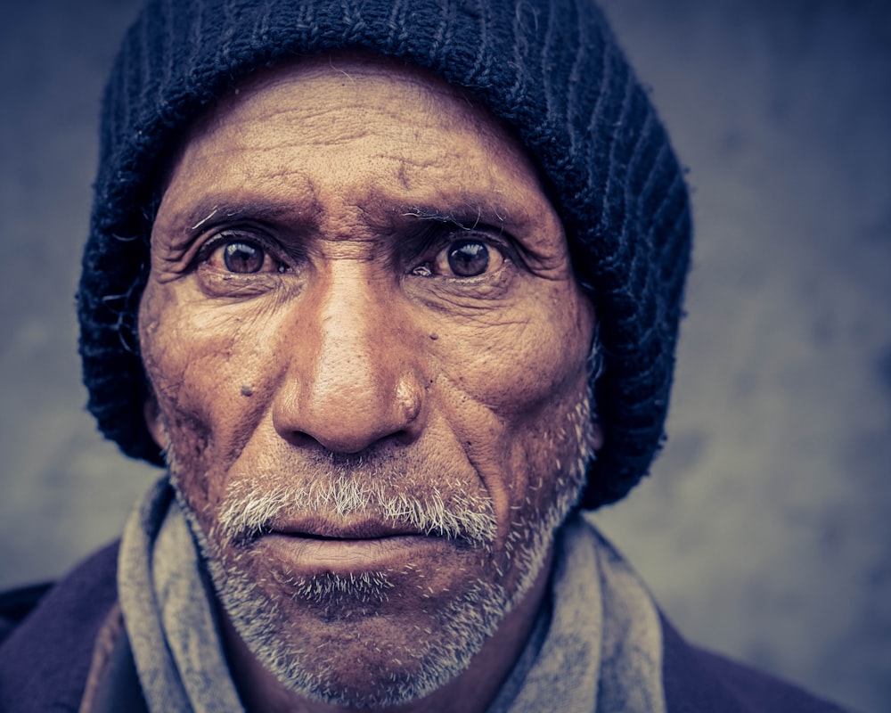 man wearing black knit cap