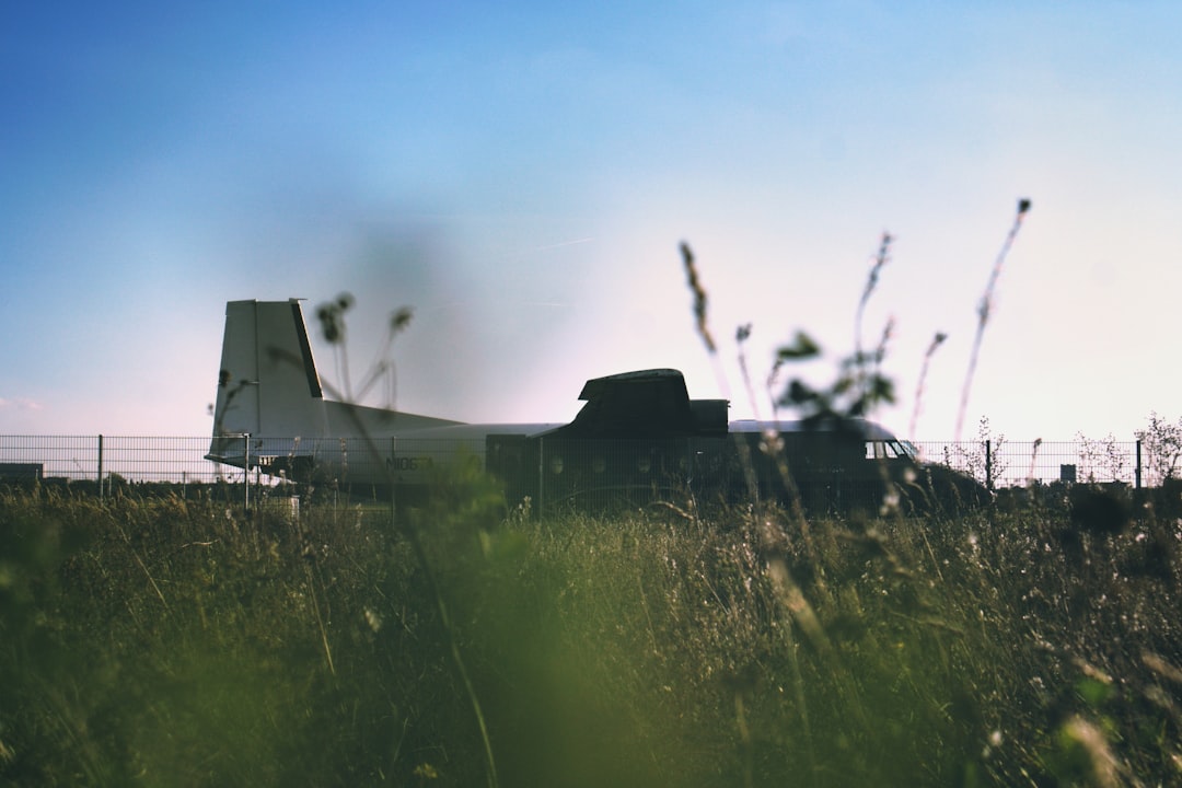 parked white and brown plane