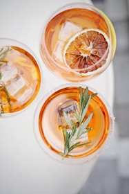 four glass cups on white surface