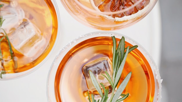 four glass cups on white surface