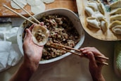 person making dumplings