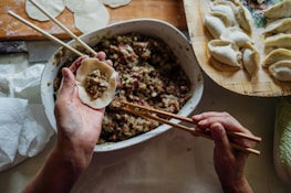 person making dumplings