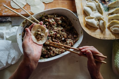 person making dumplings stuffing zoom background
