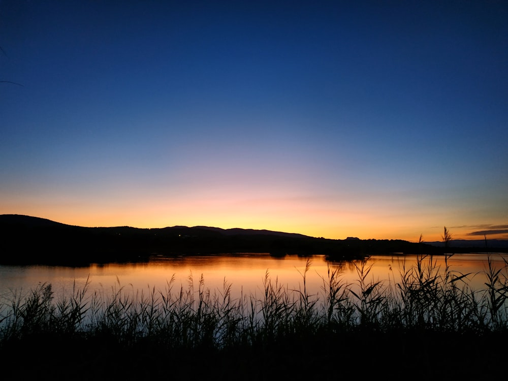 body of water during golden hour