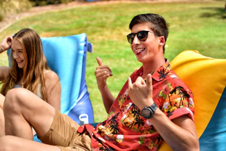 Young adults enjoying lifestyle products outdoors with soft sunlight and pastel decor.