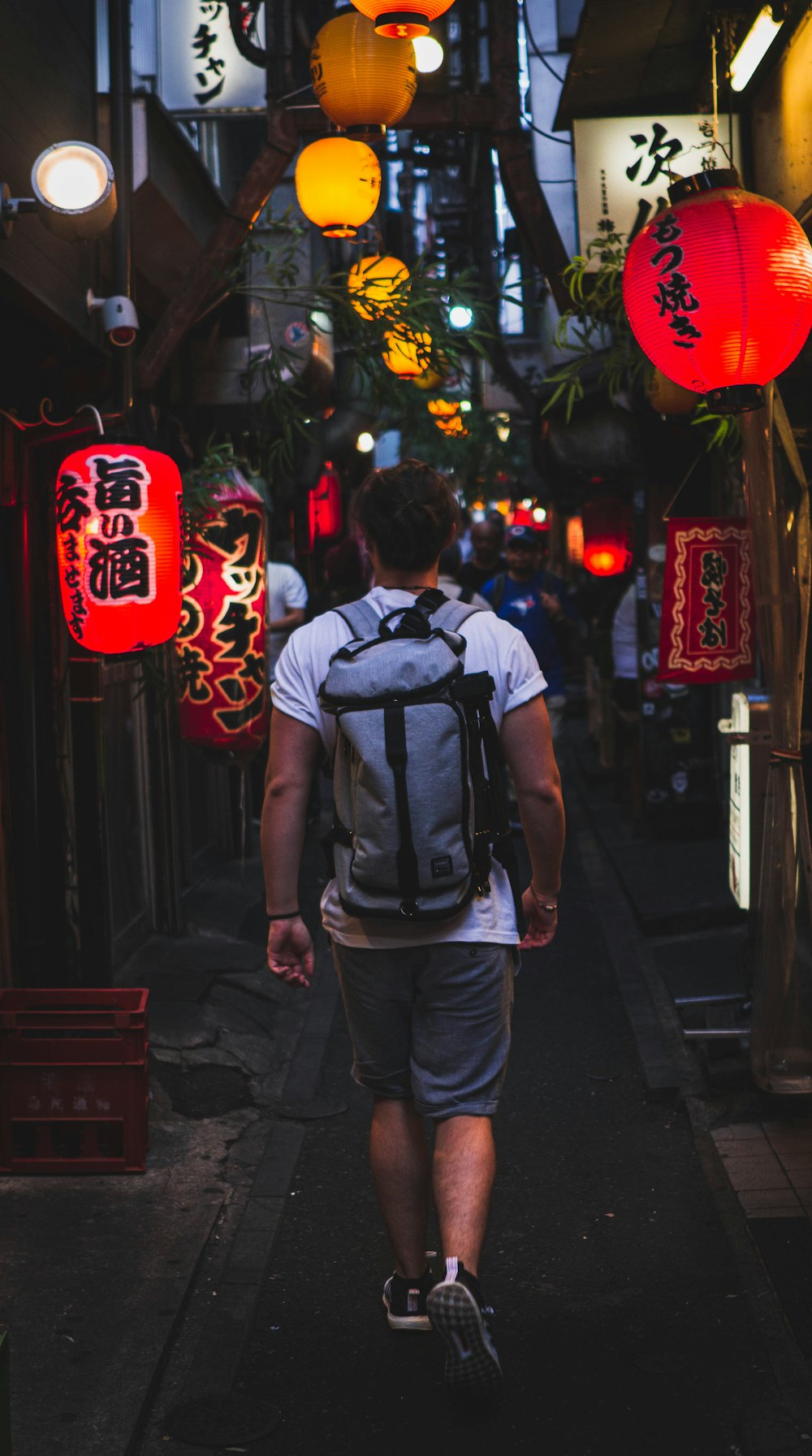 man wearing grey backpack