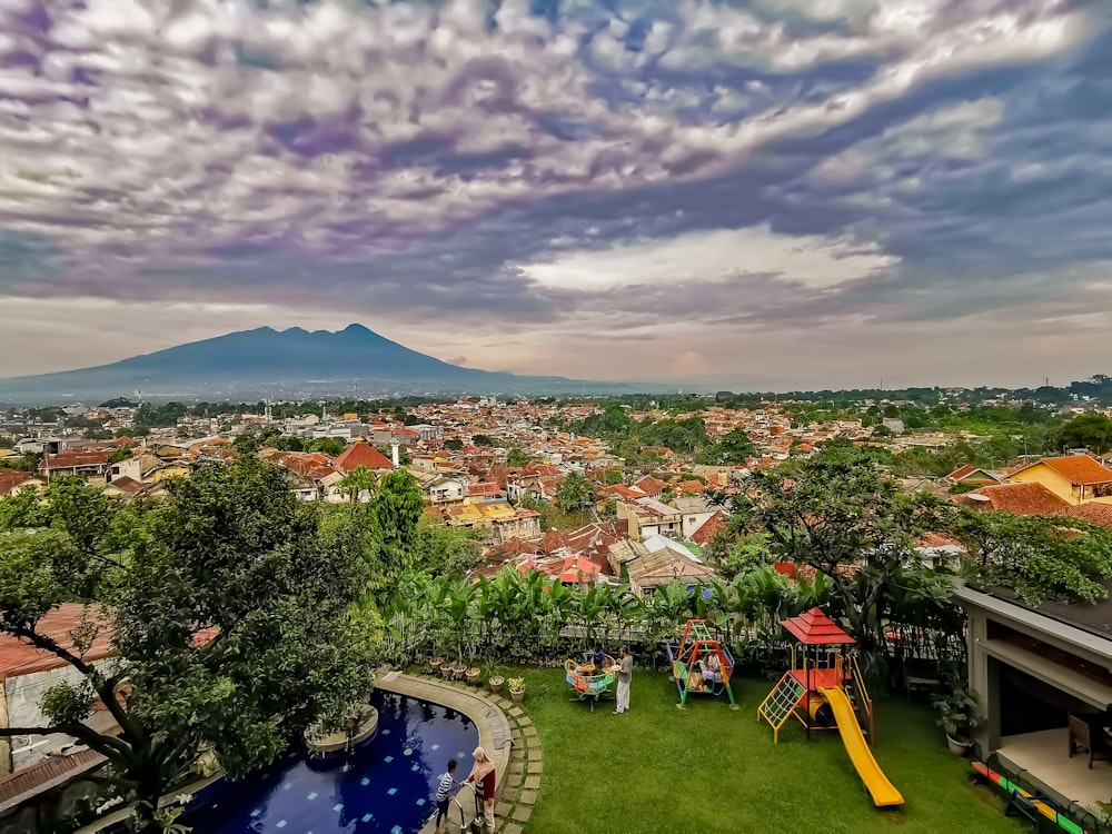 aerial photography of a village under a cloudy sky