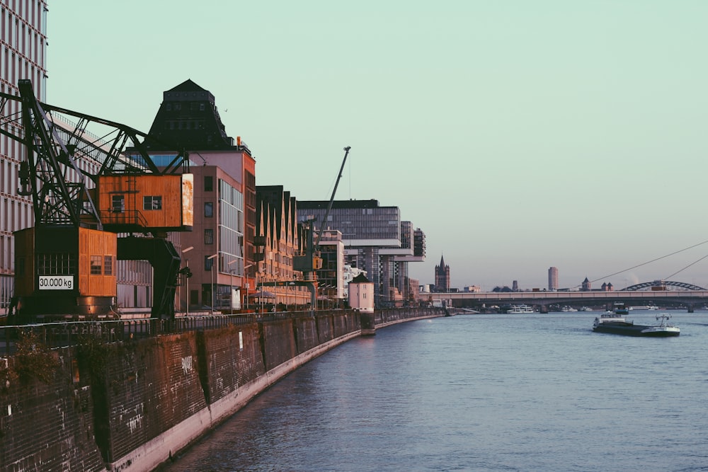 buildings by the seawall during daytime