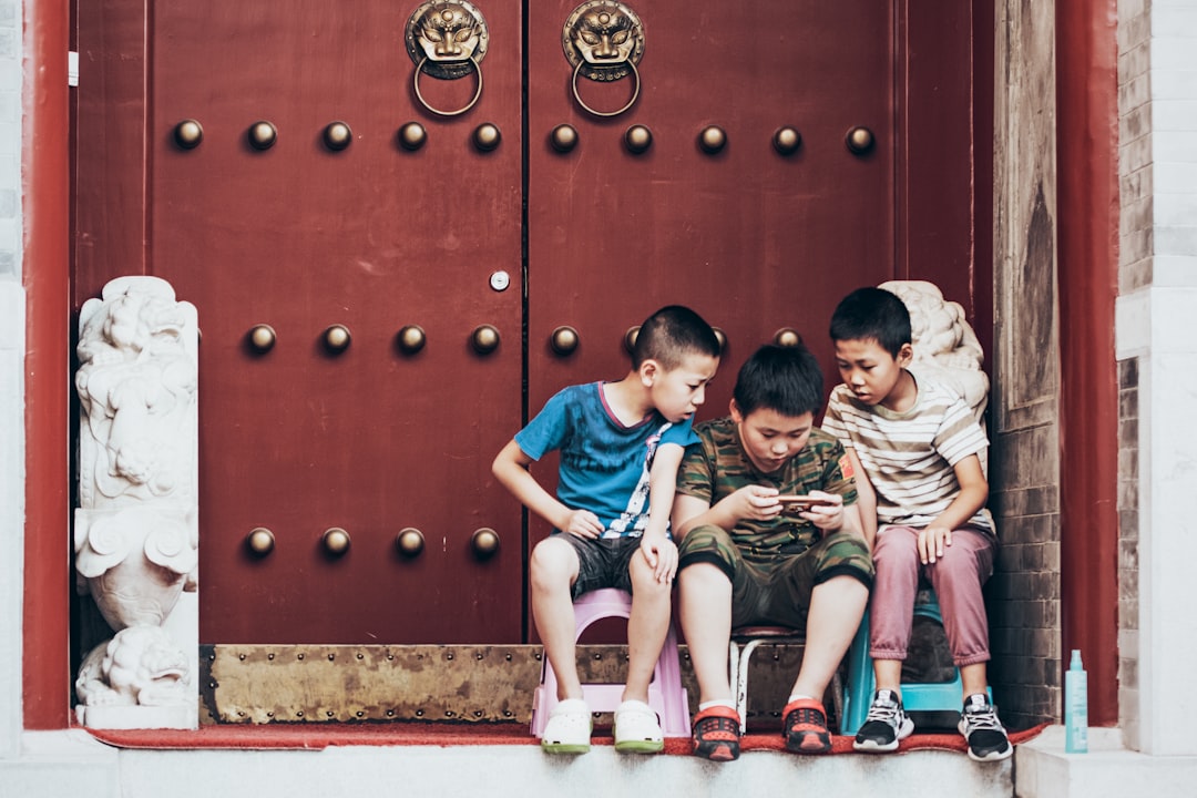 boy's playing on smartphone