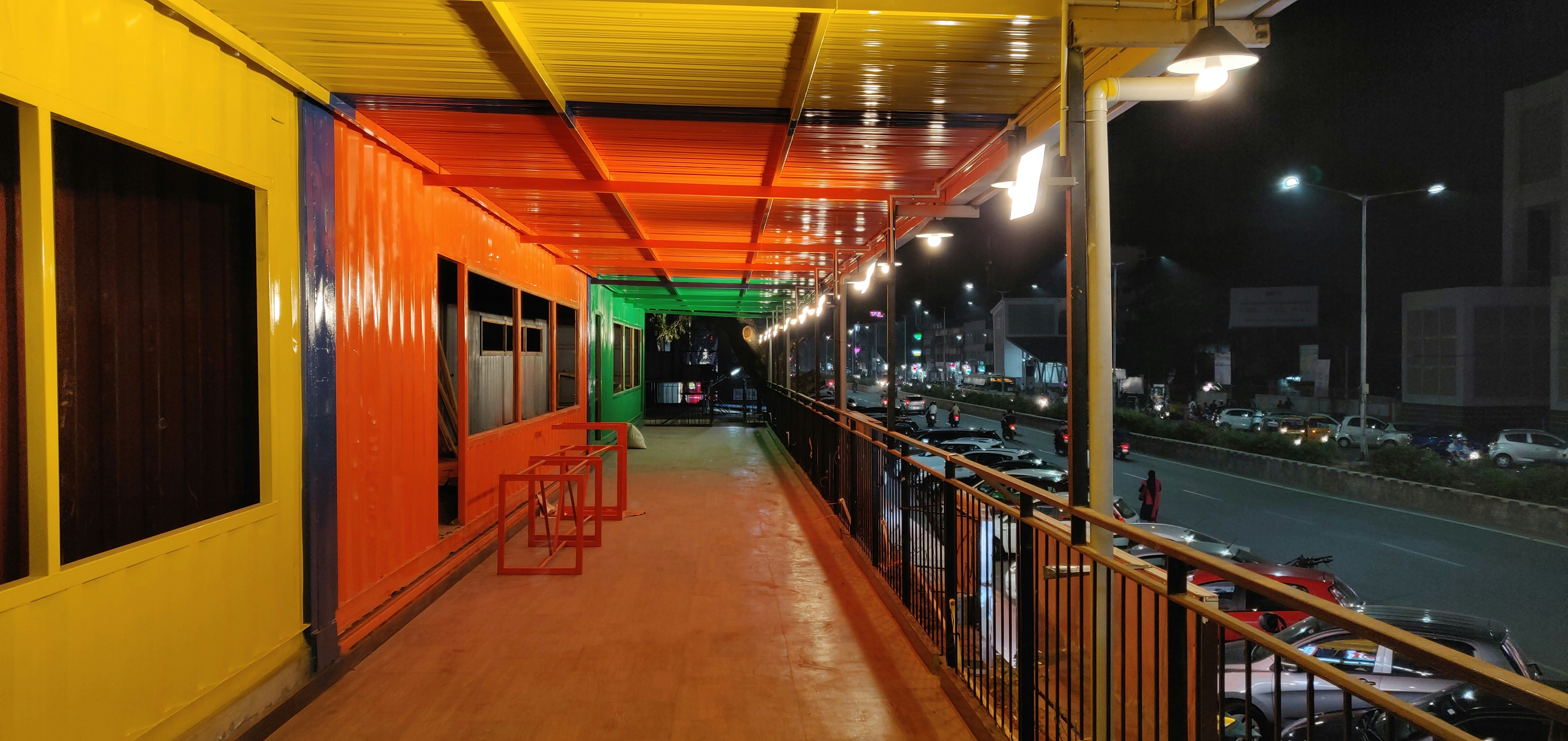 A conceptual drawing of the interior of the renovated Chennai Egmore station, showing a spacious, well-lit concourse with modern seating, digital display boards, and commercial outlets.