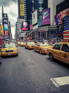 A bustling Yakuplu street scene with taxis waiting for passengers.