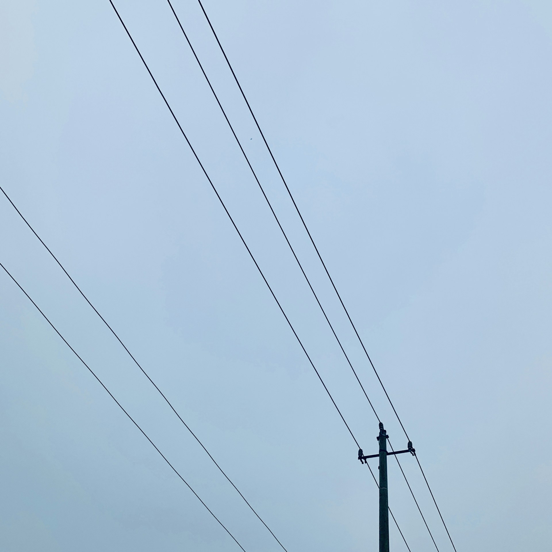 black utility post during daytime