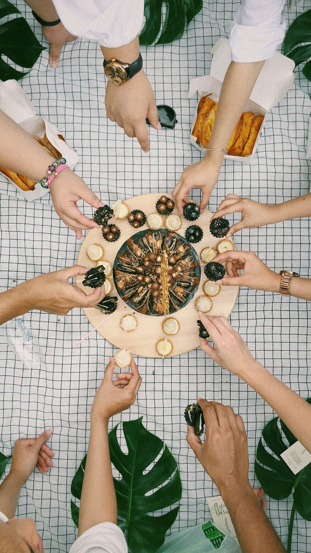 peoples hands on round plate